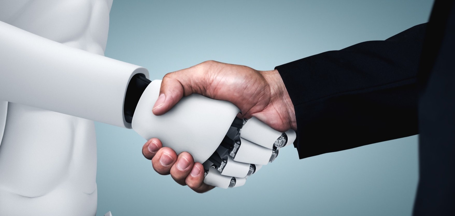 Human and robot shaking hands