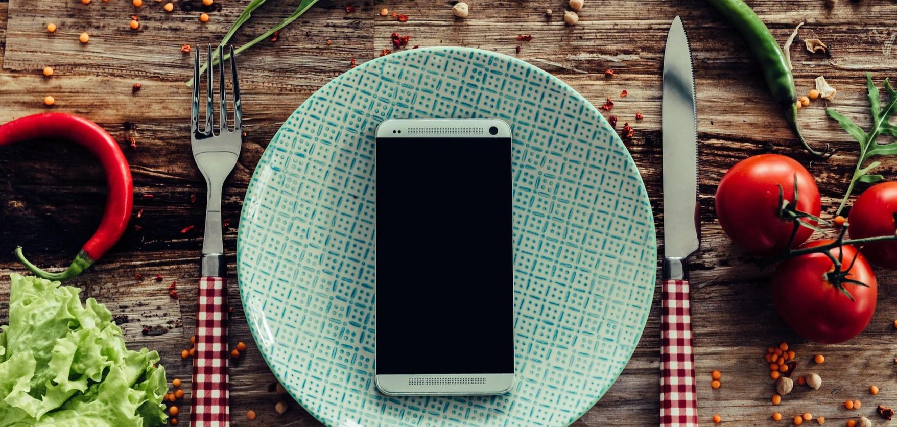 Smartphone on a plate with cutlery