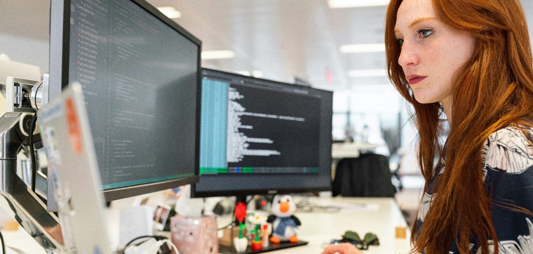 Developer working across multiple screens